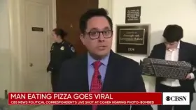 Guy gets caught eating pizza on live TV. No shame.