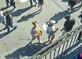 sexy and confident woman flashes boobs during mardi gras on earthcam