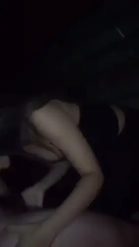 Young couple enjoying themselves on the kids’ playground at night