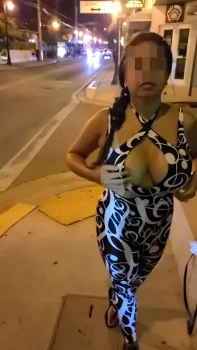 Latina MILF teasing drivers as they pass by