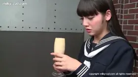 Struggles with a glass of cum