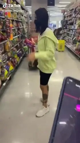 Controlling her vibrator at a shop