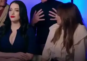 Elizabeth Olsen checking out Kat Dennings