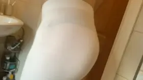 Me wearing a woman’s black thong and women’s white leggings