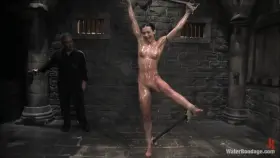 Wenona gets strung up spread-eagled, covered in oil, and flogged all over