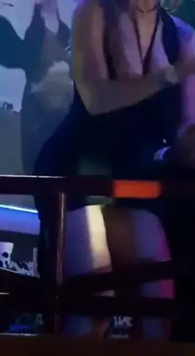 No panties in the club holding a cigarette