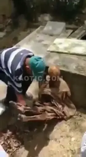 Person Seen Putting Body In Grave
