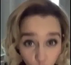 Emilia looking up at you while giving you a slow sensual blowjob