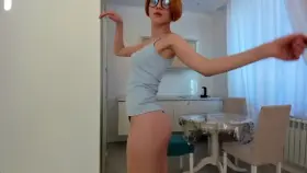 Just a busty redhead teasing and dancing