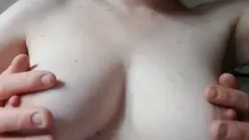 Playing with her hard nipples