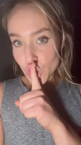 This tiny gray tank top really straps them down