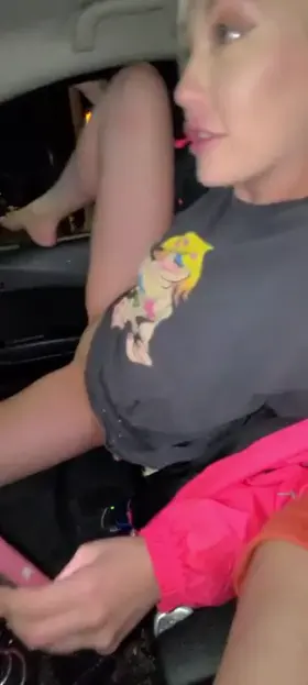 Fingering herself out the car window