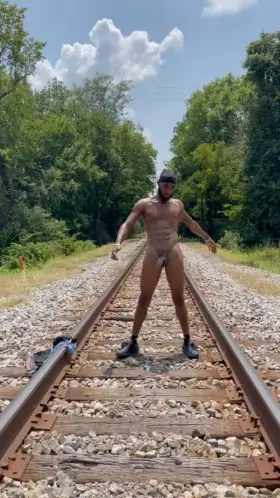 Standing on the RAILROAD tracks beating that DICK.