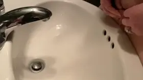 My wi(f)e being naughty and pissing into the sink in this public restroom