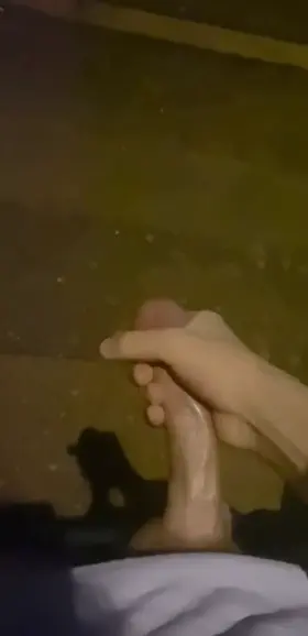 Soaking the street at night under a street light !