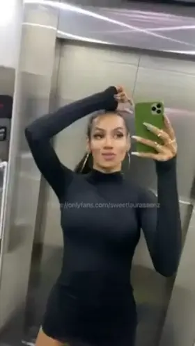 She shakes her huge cock in the elevator!