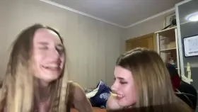 Two embarrassed girls flashing hot tits