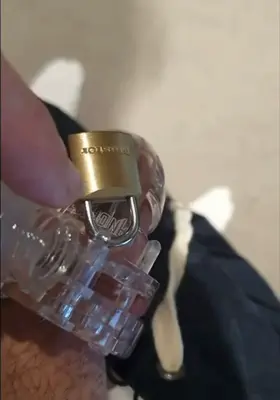 I made my sub pour my spit all over his locked dick