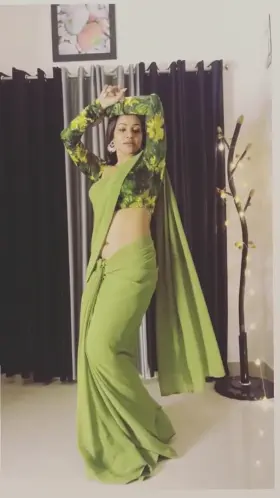 Leesha Eclairs in saree shows off her navel