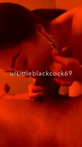 Asian pro licking balls & gives handjob at the same time