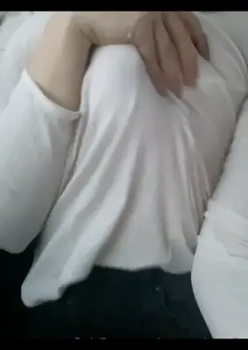 grabbing herself in the car