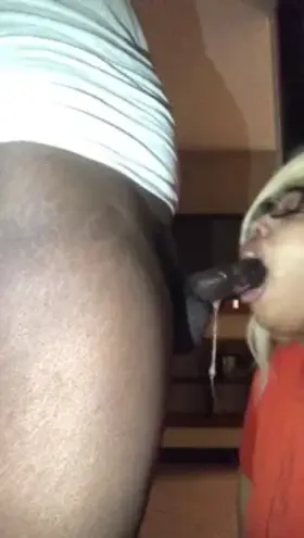 Cute ebony giving sloppy head