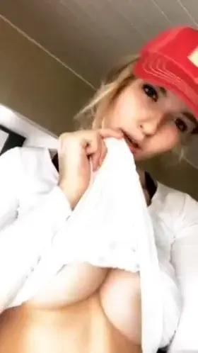 Releasing her perfect breasts