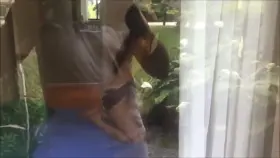 hubby locked out on balcony watching his wife getting satisfied.