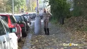 A hot blonde takes a piss in broad daylight on the street, she doesn't care who sees!