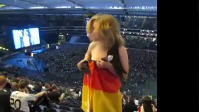 Flashing boobs to support her team