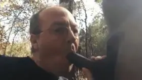 sucking a black cock outdoors