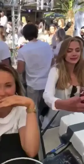 Party girl has her shirt blown down, bare tits exposed